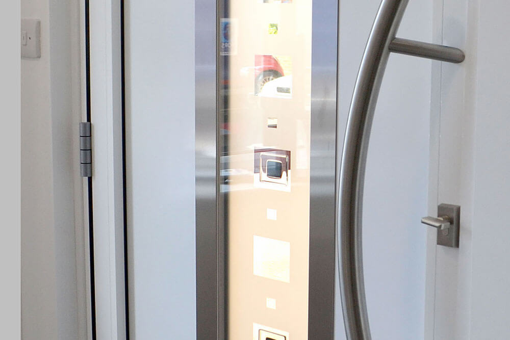 Close up of a white aluminium entrance door